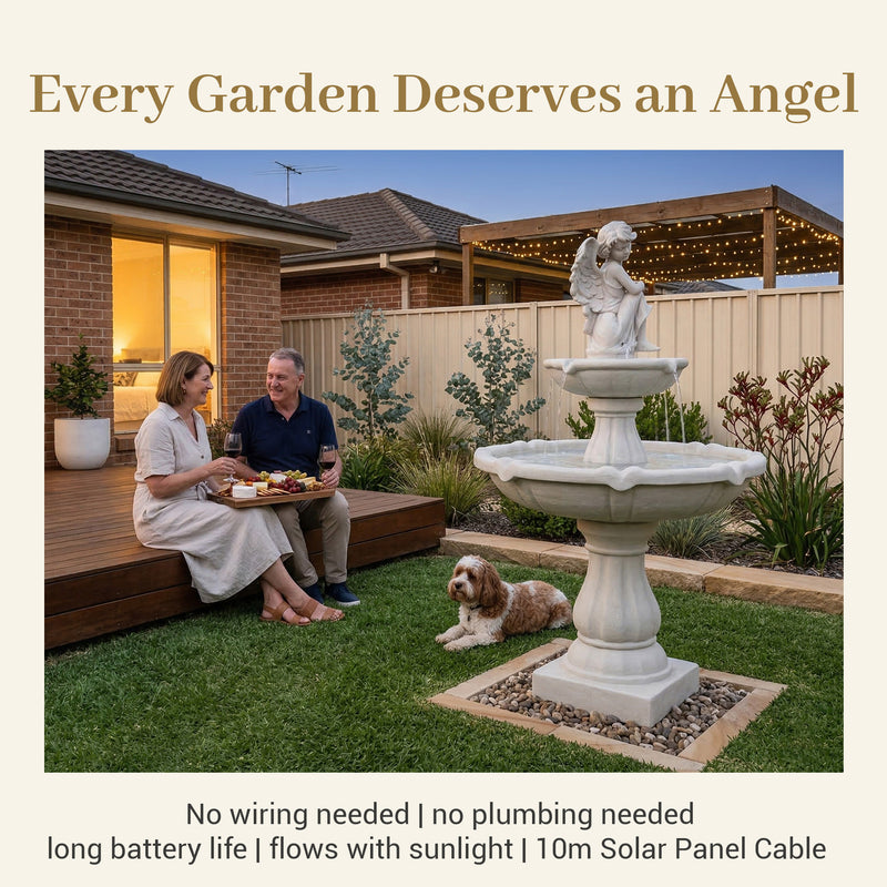 Couple relaxing with wine beside illuminated angel fountain at dusk, with text overlay “Every Garden Deserves an Angel” and specs “No wiring | no plumbing | 10m solar cable” — emphasizing effortless installation and romantic evening appeal.