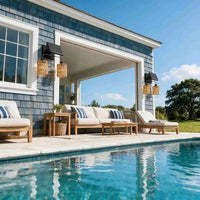 Double head solar sconce with woven shades on blue shingle house by swimming pool