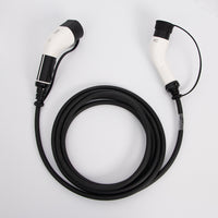 An electric vehicle charging cable with a coiled black hose and two white and black connector heads, photographed on a clean white background.