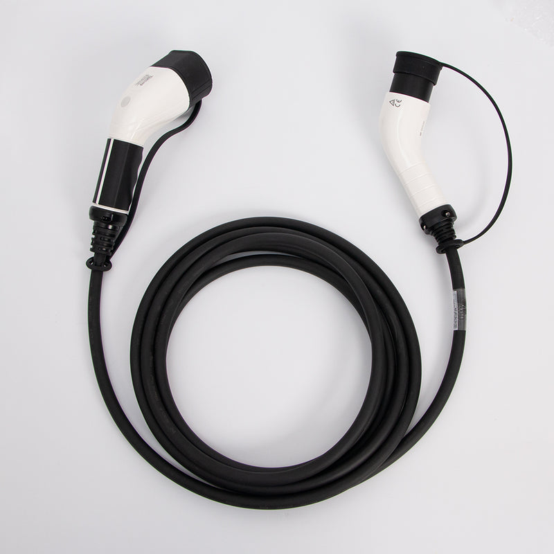 An electric vehicle charging cable with a coiled black hose and two white and black connector heads, photographed on a clean white background.