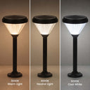 Three vertical panels show a solar post light in three color modes: 3000K Warm Light, 4000K Neutral Light, and 6000K Cool White. The light has a black solar top and base with a pleated shade that glows warm, neutral, or cool white respectively against a dark gradient background.