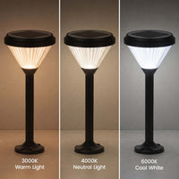 Three vertical panels show a solar post light in three color modes: 3000K Warm Light, 4000K Neutral Light, and 6000K Cool White. The light has a black solar top and base with a pleated shade that glows warm, neutral, or cool white respectively against a dark gradient background.