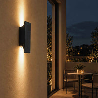 PT0710 solar up and down wall light creating warm architectural lighting on an outdoor patio