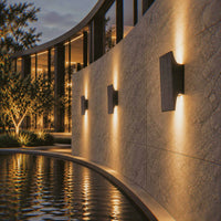 PT0710 solar wall lights creating warm up and down illumination along a modern poolside wall