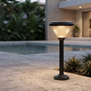 Ulyx PT0300 solar garden path light providing warm outdoor lighting beside a pool