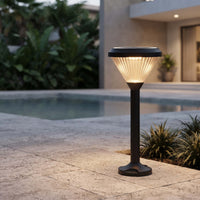 Ulyx PT0300 solar garden path light providing warm outdoor lighting beside a pool