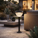 Goya PT0301 solar garden light providing warm pathway lighting beside an outdoor patio