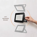 A black outdoor LED floodlight with an adjustable bracket is mounted on a white wall. A human hand is shown turning a side adjustment knob, with text reading '270° Adjustable Bracket' and faded duplicate views of the light showing the range of motion.
