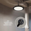 A circular black hanging light fixture with a glowing white diffuser is shown installed on a ceiling in a real interior space. A circular inset highlights the Australian plug and exposed cable, with text reading 'SAA Australian plug (Approx.