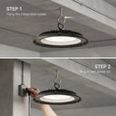 Two-panel instructional graphic showing how to install and power on a hanging industrial LED light. Top panel shows the integrated eyelet hanging from a ceiling hook with text 'STEP 1 Hang the integrated eyelet.