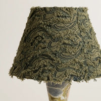 Close-up of the olive green knitted jacquard fabric shade on the Forest Ember table lamp