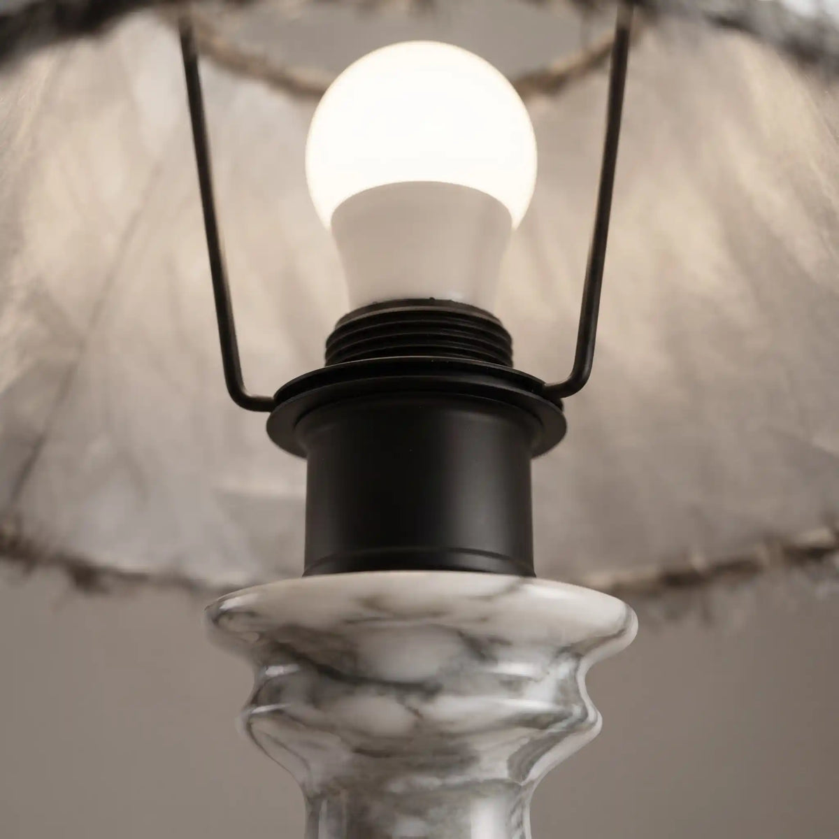 E27 bulb and lamp holder inside the fabric shade of the Freehand marble table lamp