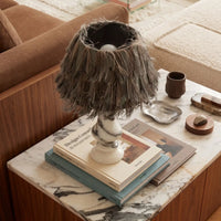 Freehand Arabescato Marble Table Lamp styled on a marble-top table with books and decor