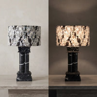 Silent Rift Black Vein Marble table lamp shown switched off and illuminated with warm light