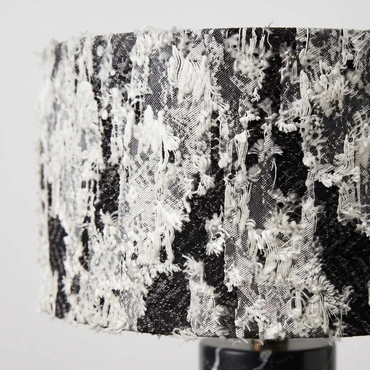 Close-up of the black and white textured fabric shade on the Silent Rift table lamp