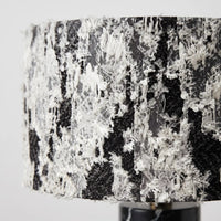 Close-up of the black and white textured fabric shade on the Silent Rift table lamp