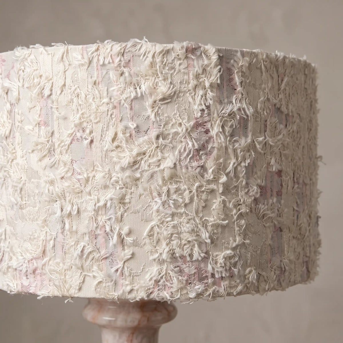 Close-up of the textured fabric shade above the Rainbow Rose Marble lamp base