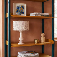Rainbow Rose Marble Table Lamp styled on a warm wood bookshelf with books and decor