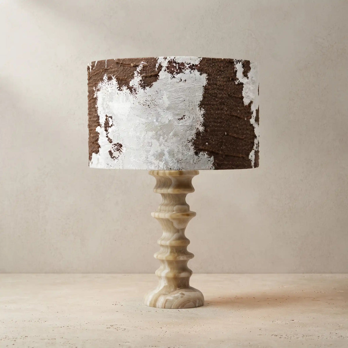 Desert Veil Tiramisu Travertine table lamp with sculpted stone base and patterned fabric shade